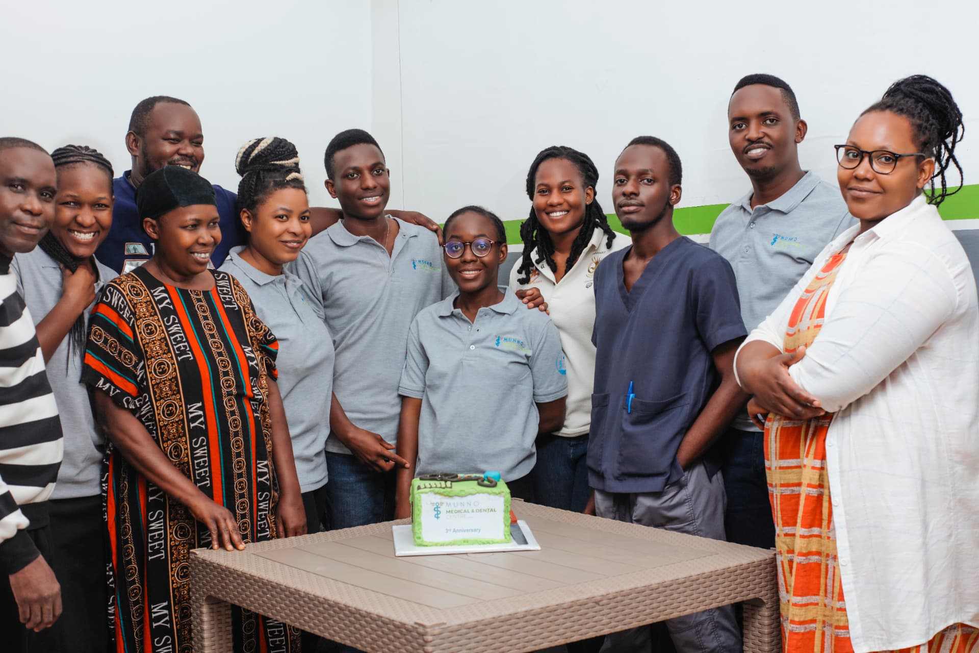 Munno Health team gathered together at a clinic celebration